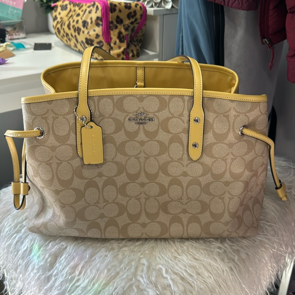 Yellow coach over the shoulder bag